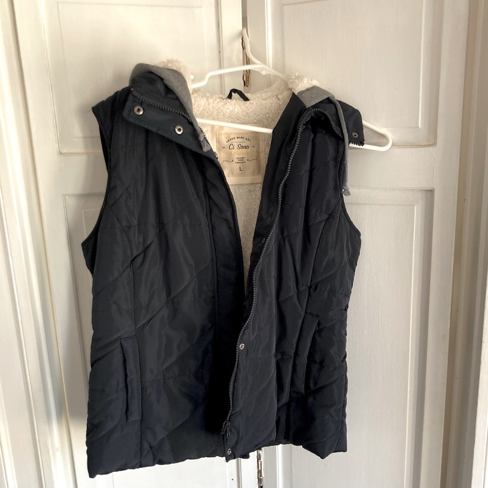 Warm, faux-fur lined vest with a grey hood